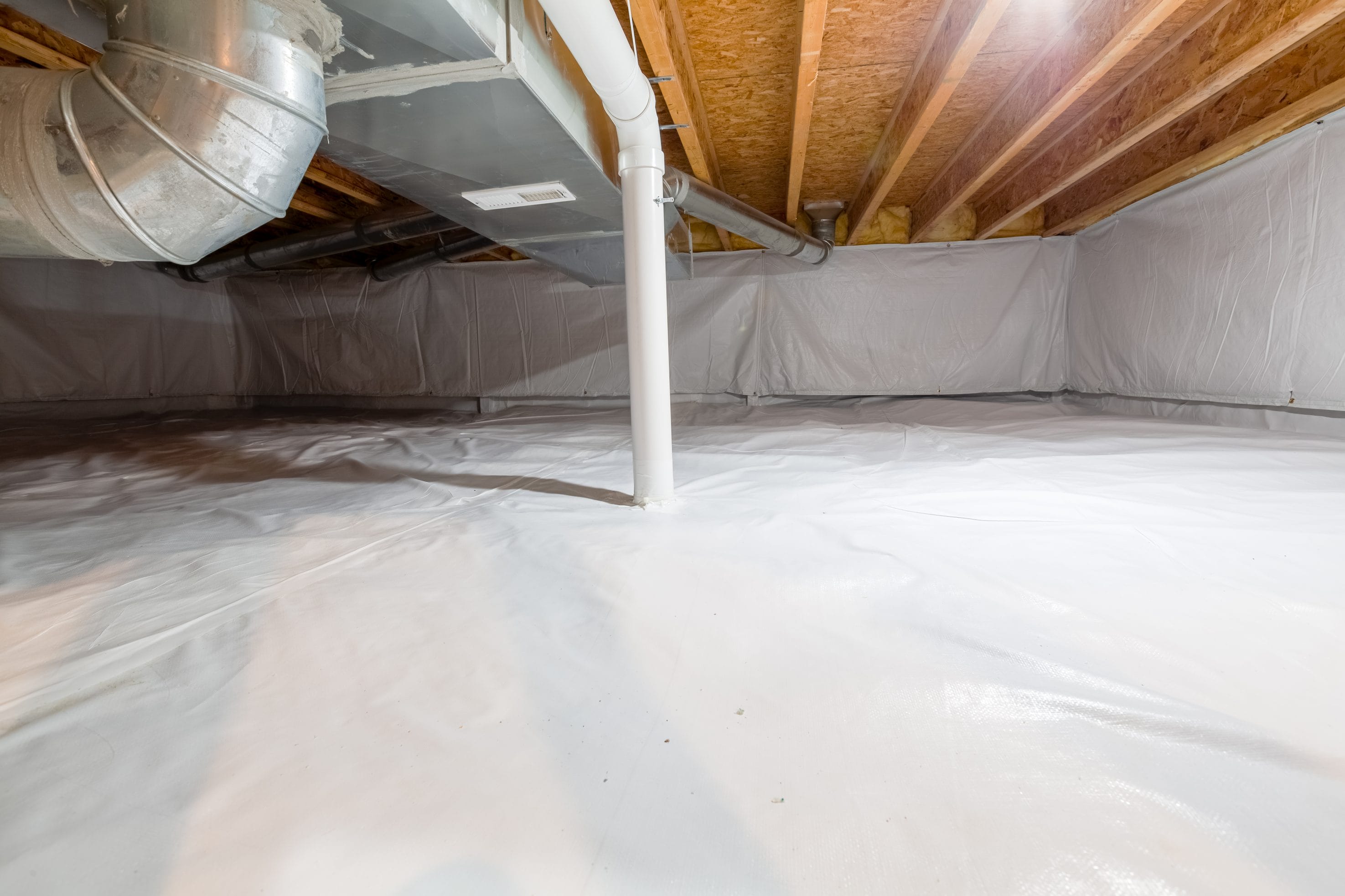 An encapsulated crawl space with piping.