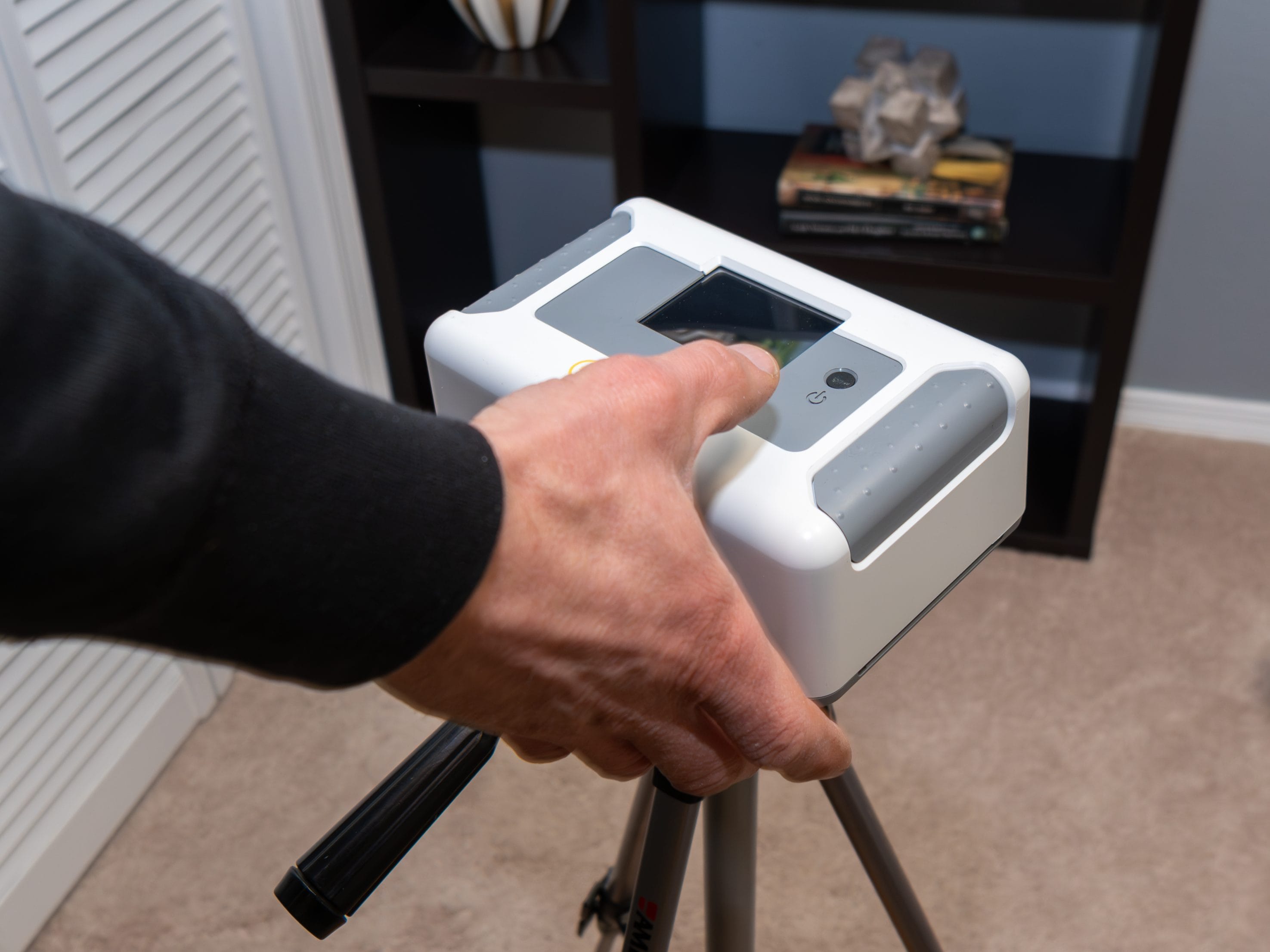 A radon testing tool measuring radon levels in an indoor space.